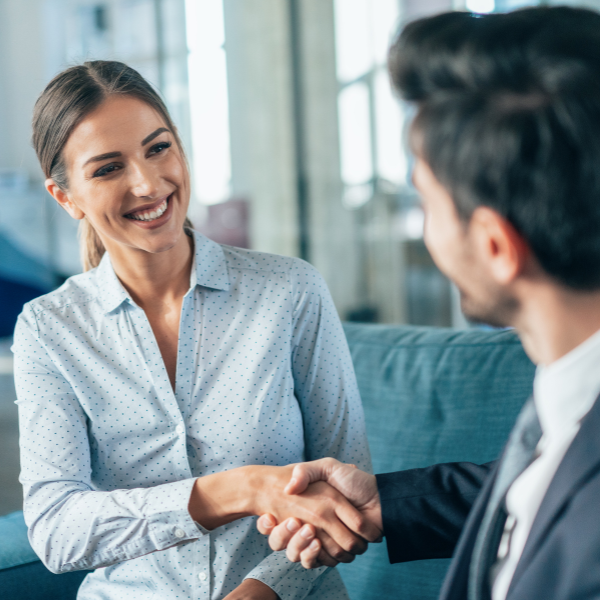 woman shaking hands with attorney